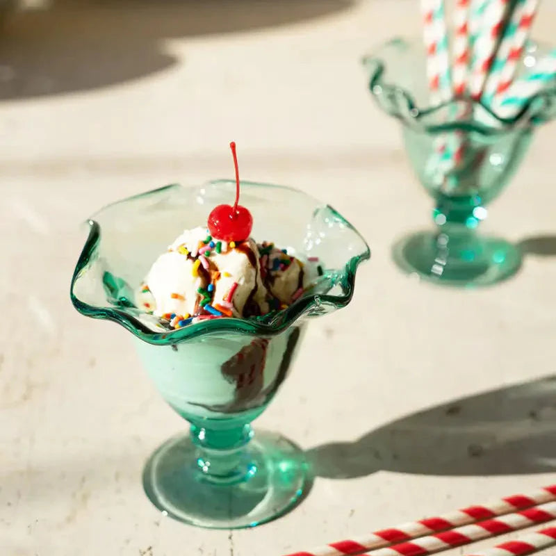 Two vintage-style green glass ice cream dishes