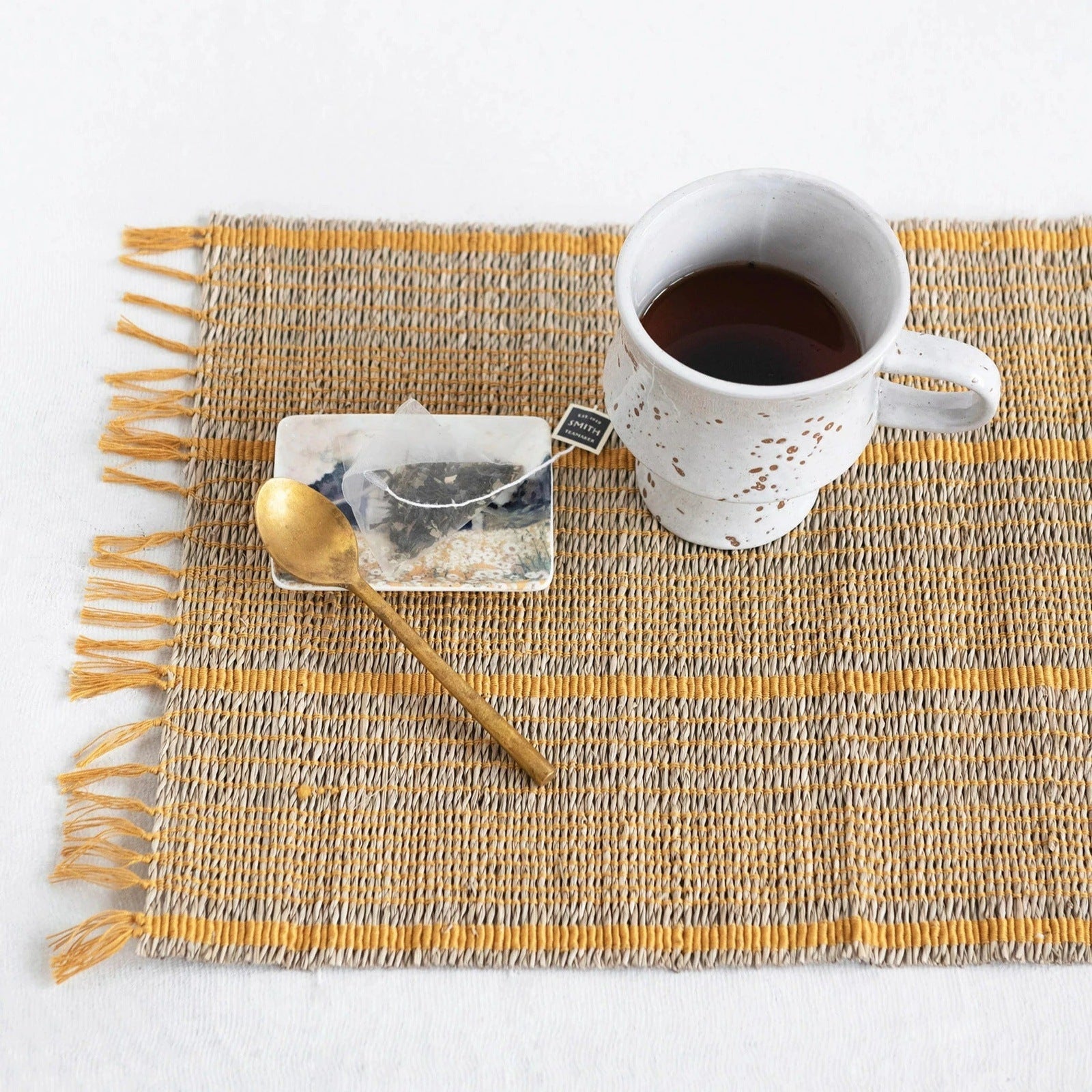 https://www.acottageinthecity.com/cdn/shop/products/Bamboo_Placemat_With_Mustard_Stripes_3_5000x.jpg?v=1667792625