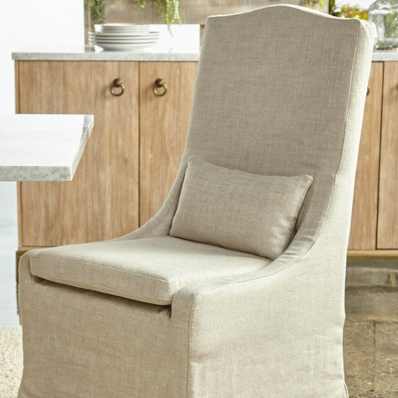 https://www.acottageinthecity.com/cdn/shop/products/Colette_Slipcover_Bisque_French_Linen_Dining_Chair_9_1200x.jpg?v=1676008915